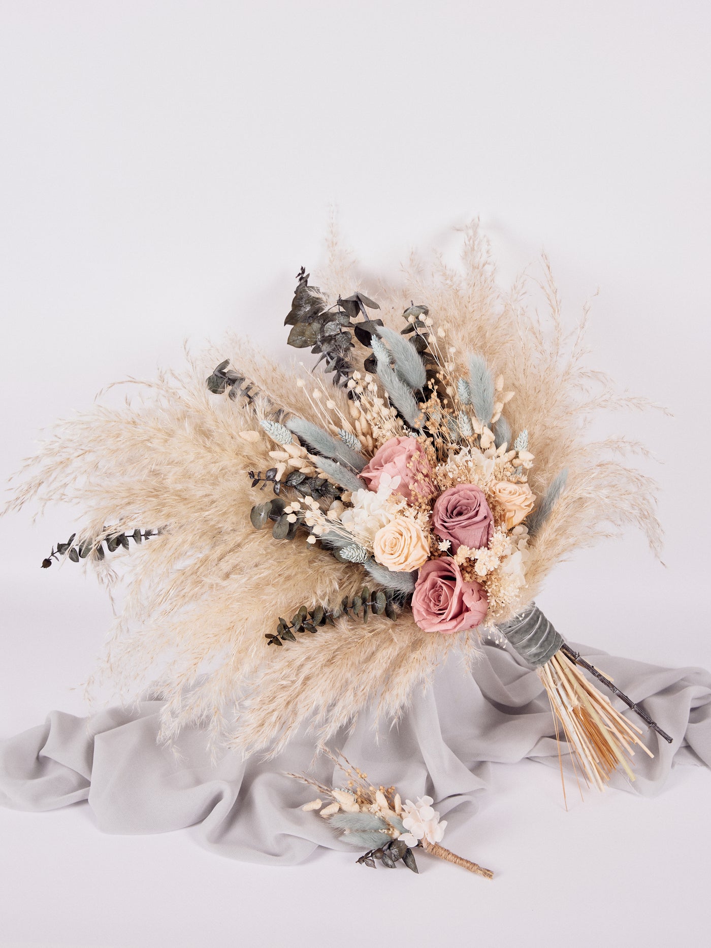 Bridal bouquet with dusty roses, pampas grass and navy dried flowers