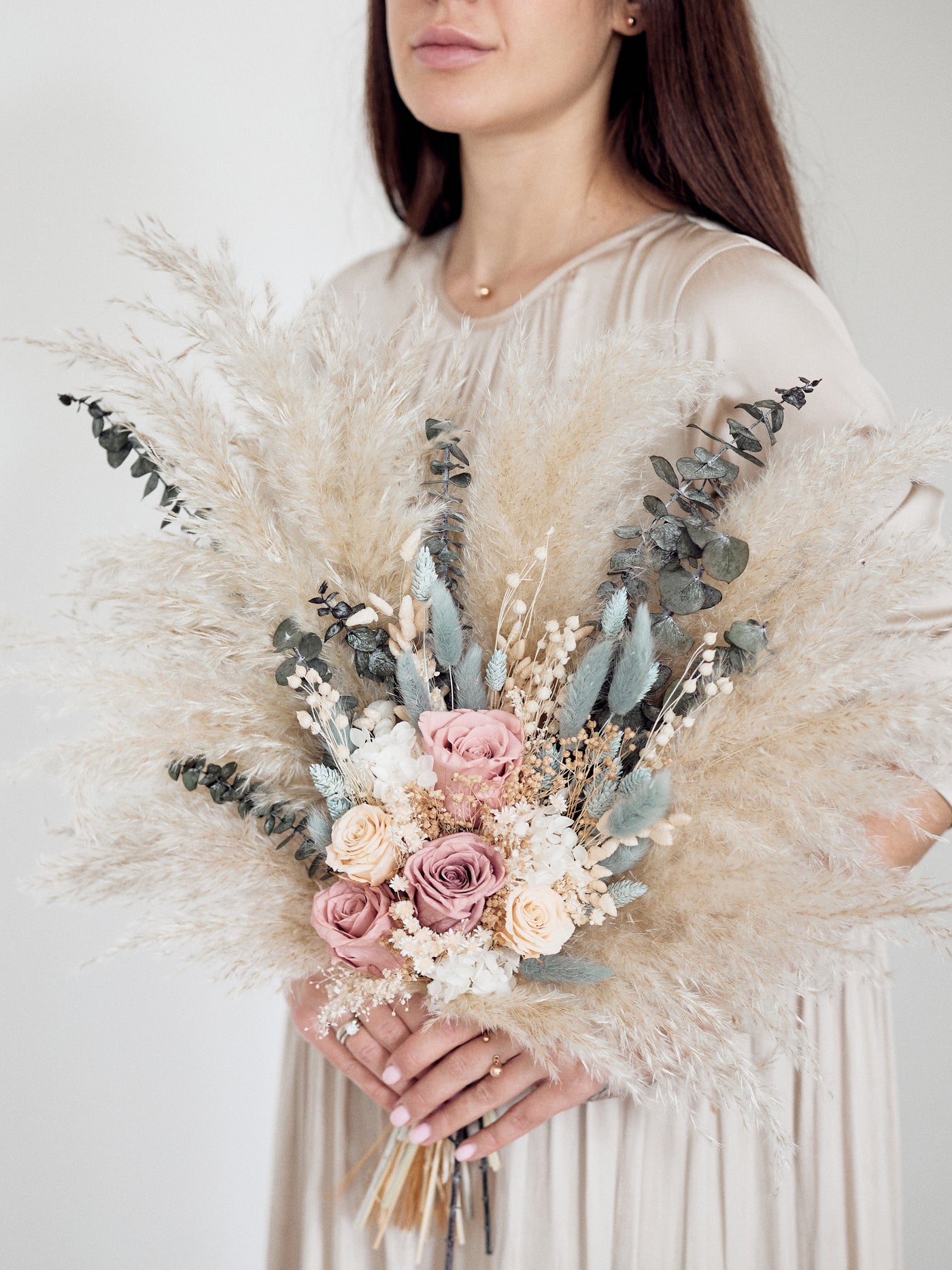 Bridal bouquet with dusty roses, pampas grass and navy dried flowers