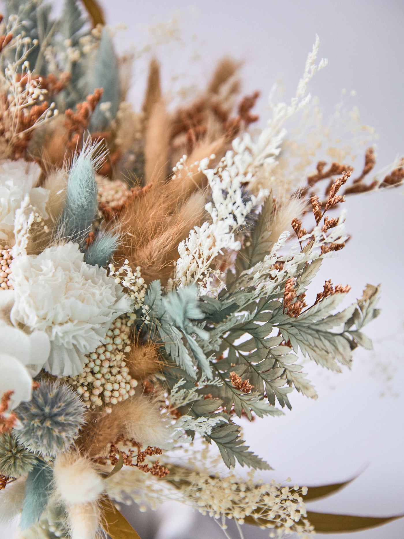 Bridal rust bouquet with sage green flowers for your wedding day