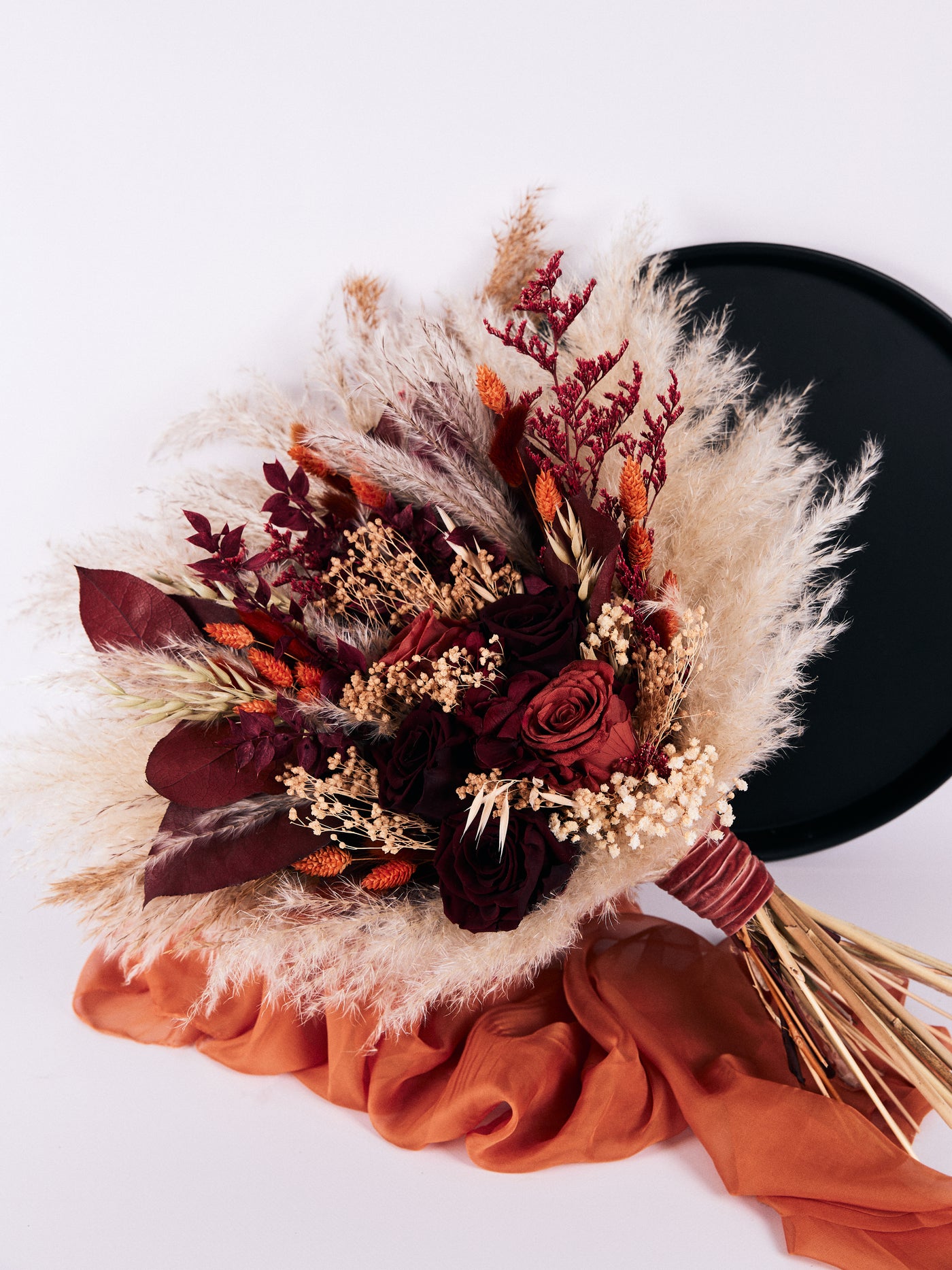 Bridal burgundy bouquet with terracotta flowers for your special day