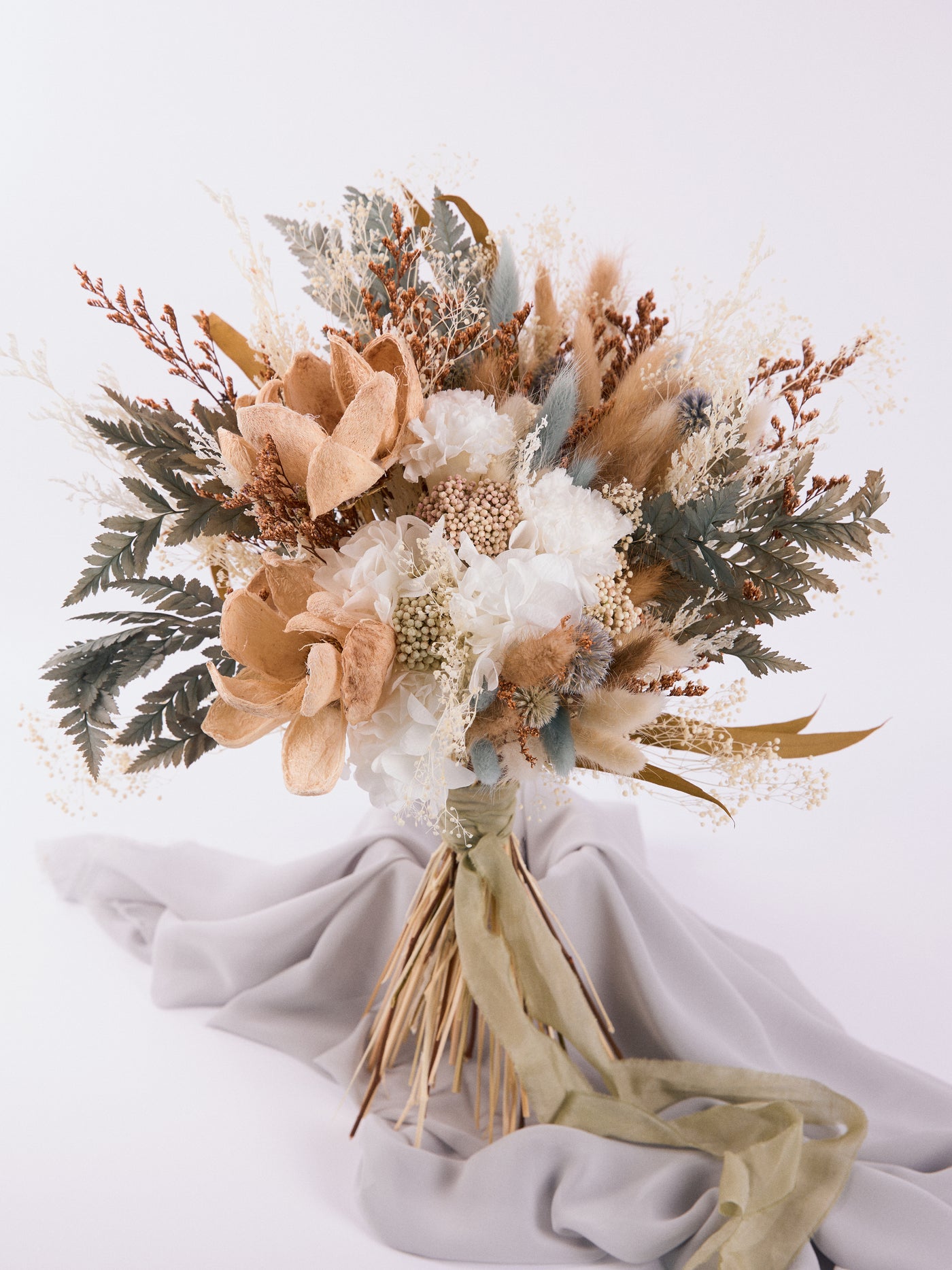 Bridal rust bouquet with sage green flowers for your wedding day