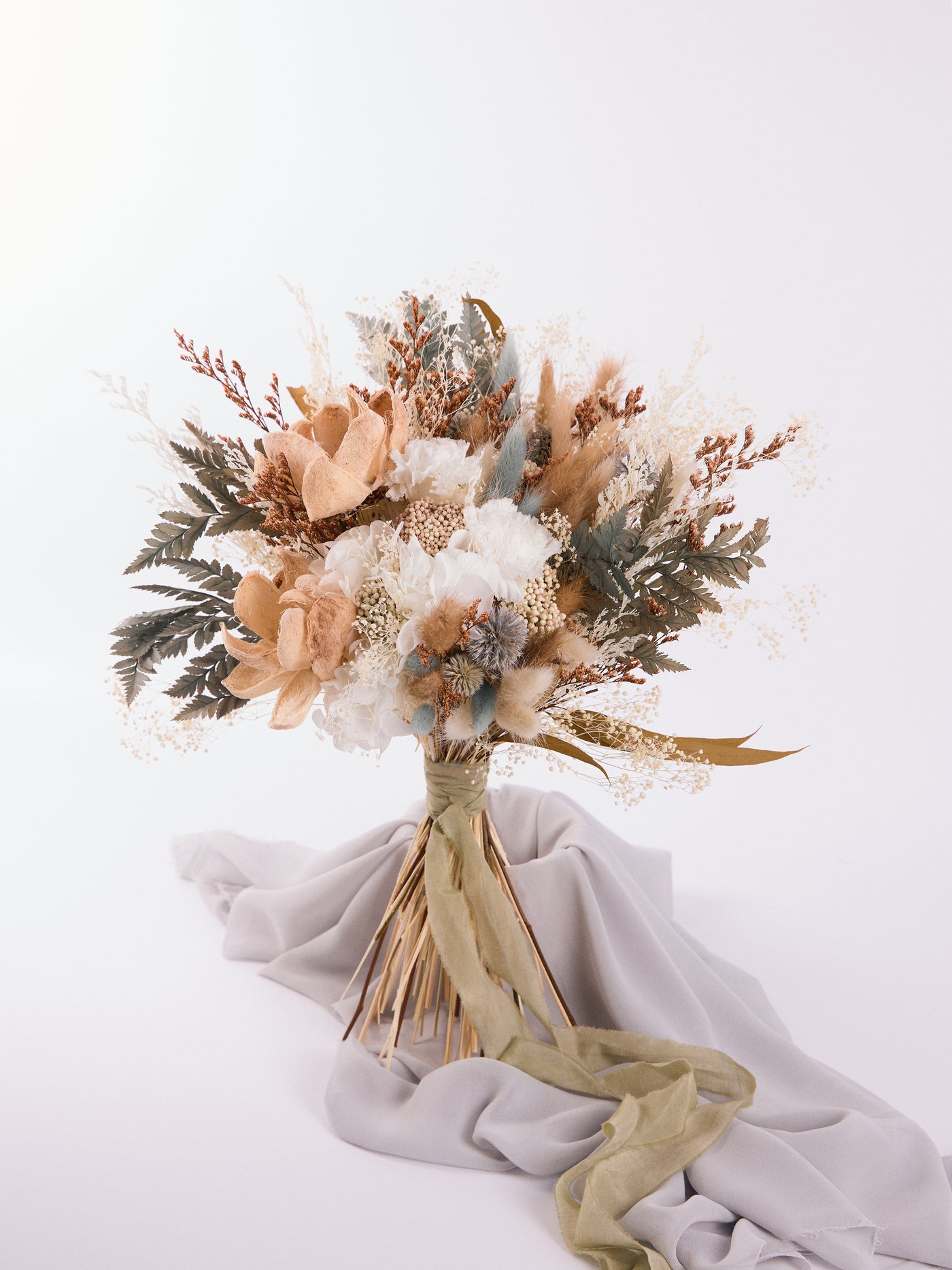 Bridal rust bouquet with sage green flowers for your wedding day