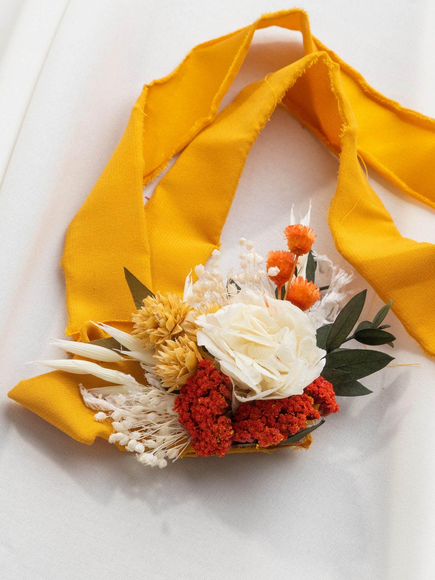 Wrist Corsage With Terracota And Yellow Flowers