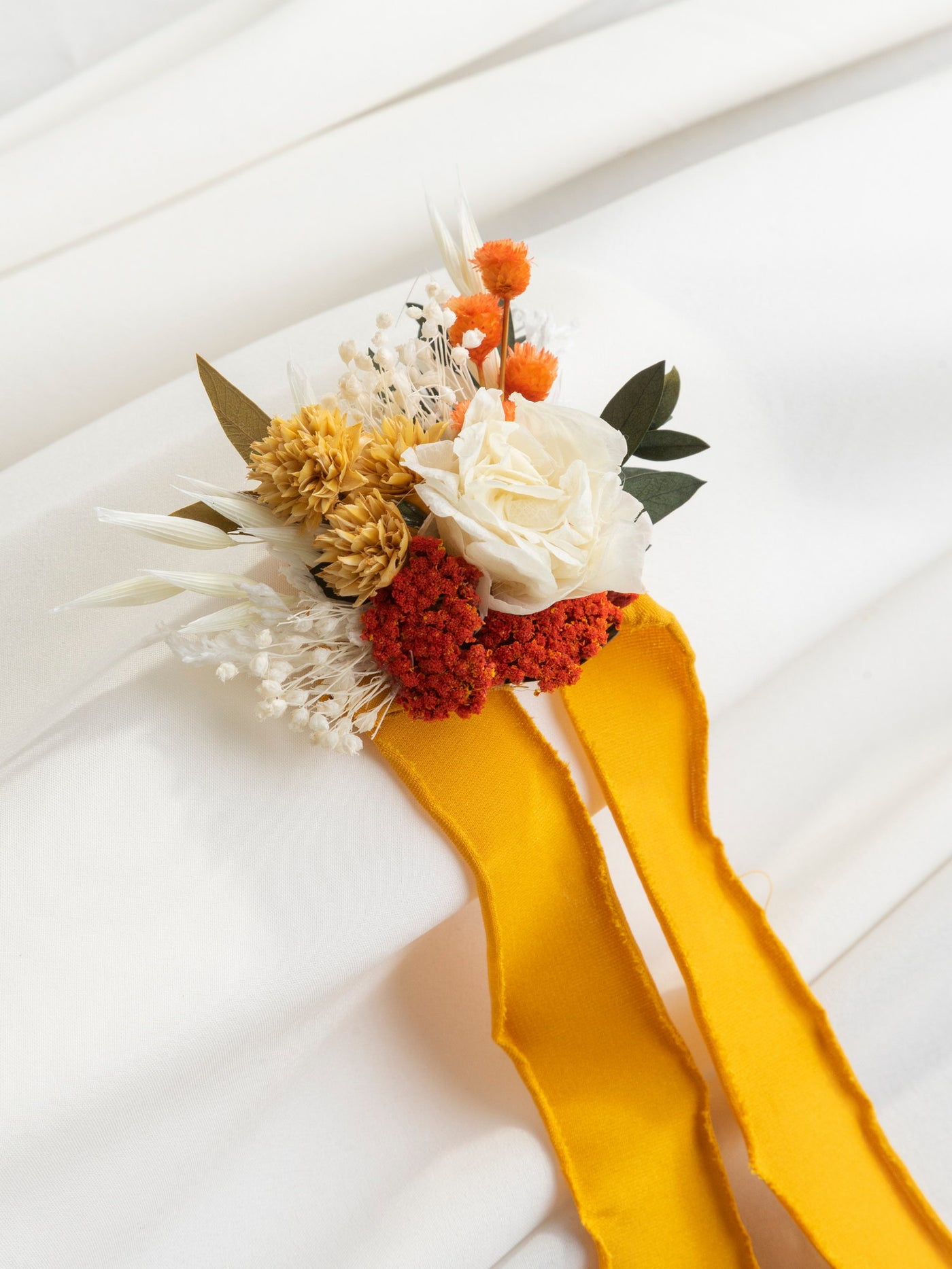 Wrist Corsage With Terracota And Yellow Flowers