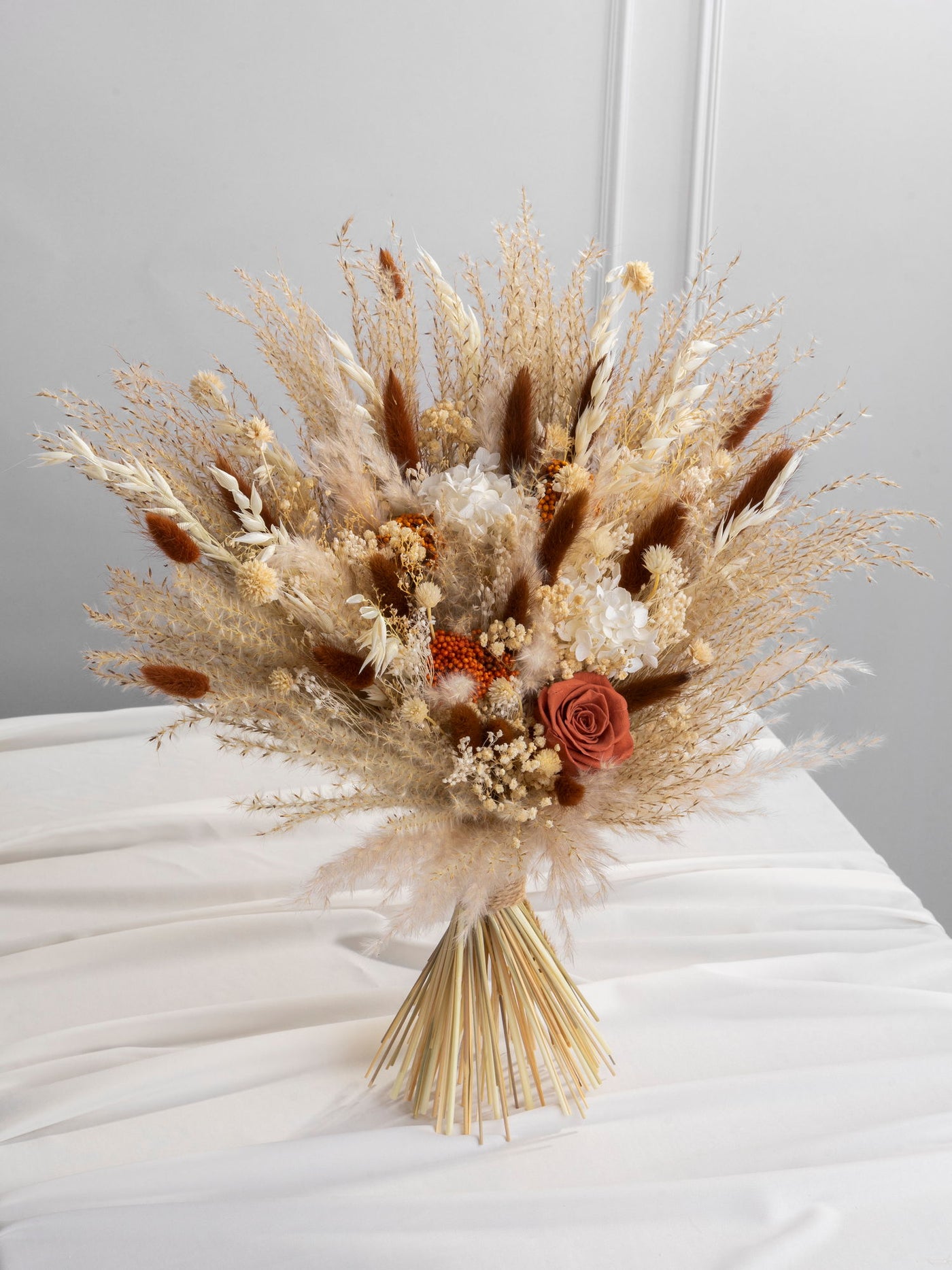 Bridal terracotta bouquet with beige dusty flowers