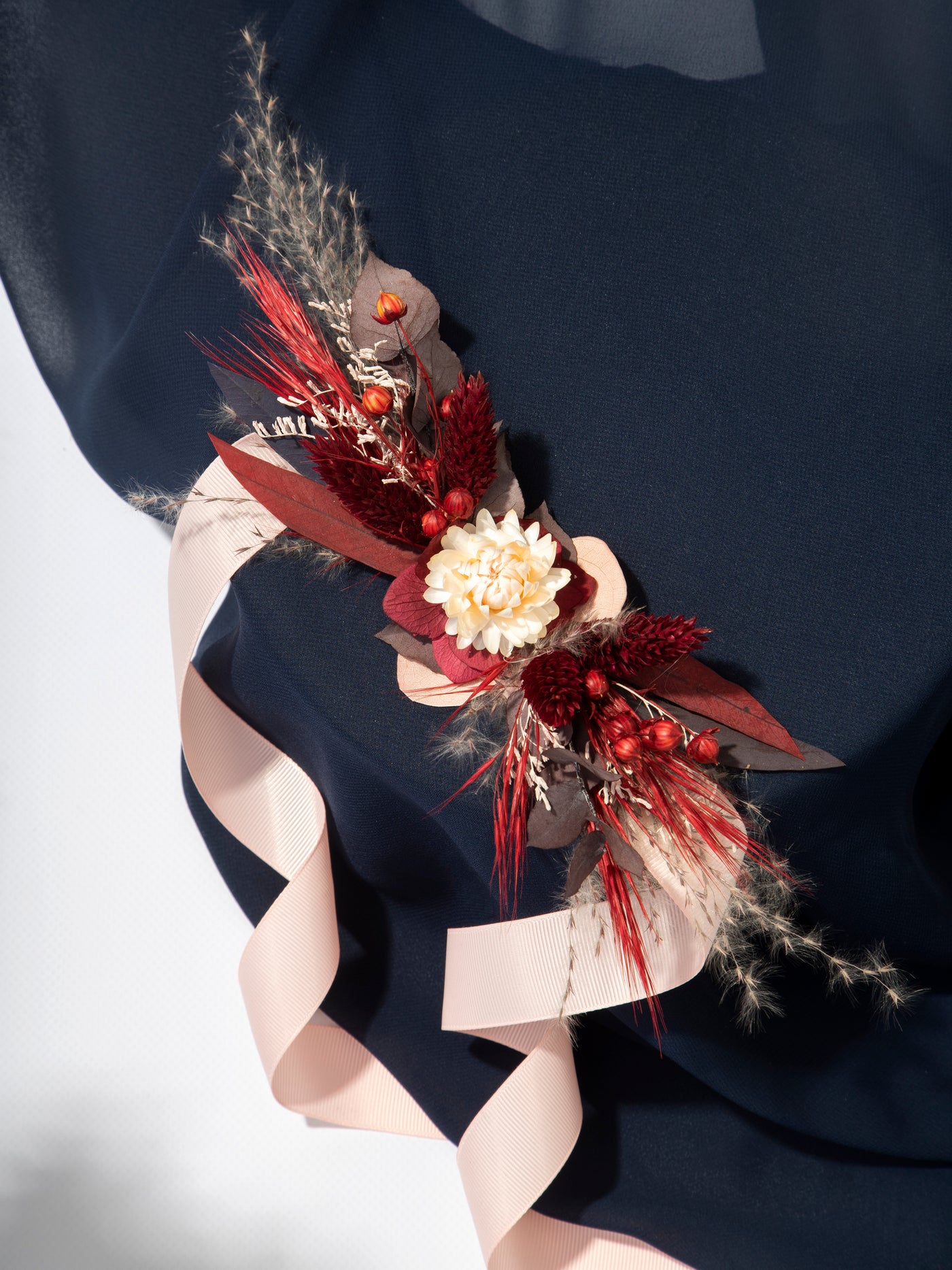 Red And Burgundy Wrist Corsage With Dusty Flowers