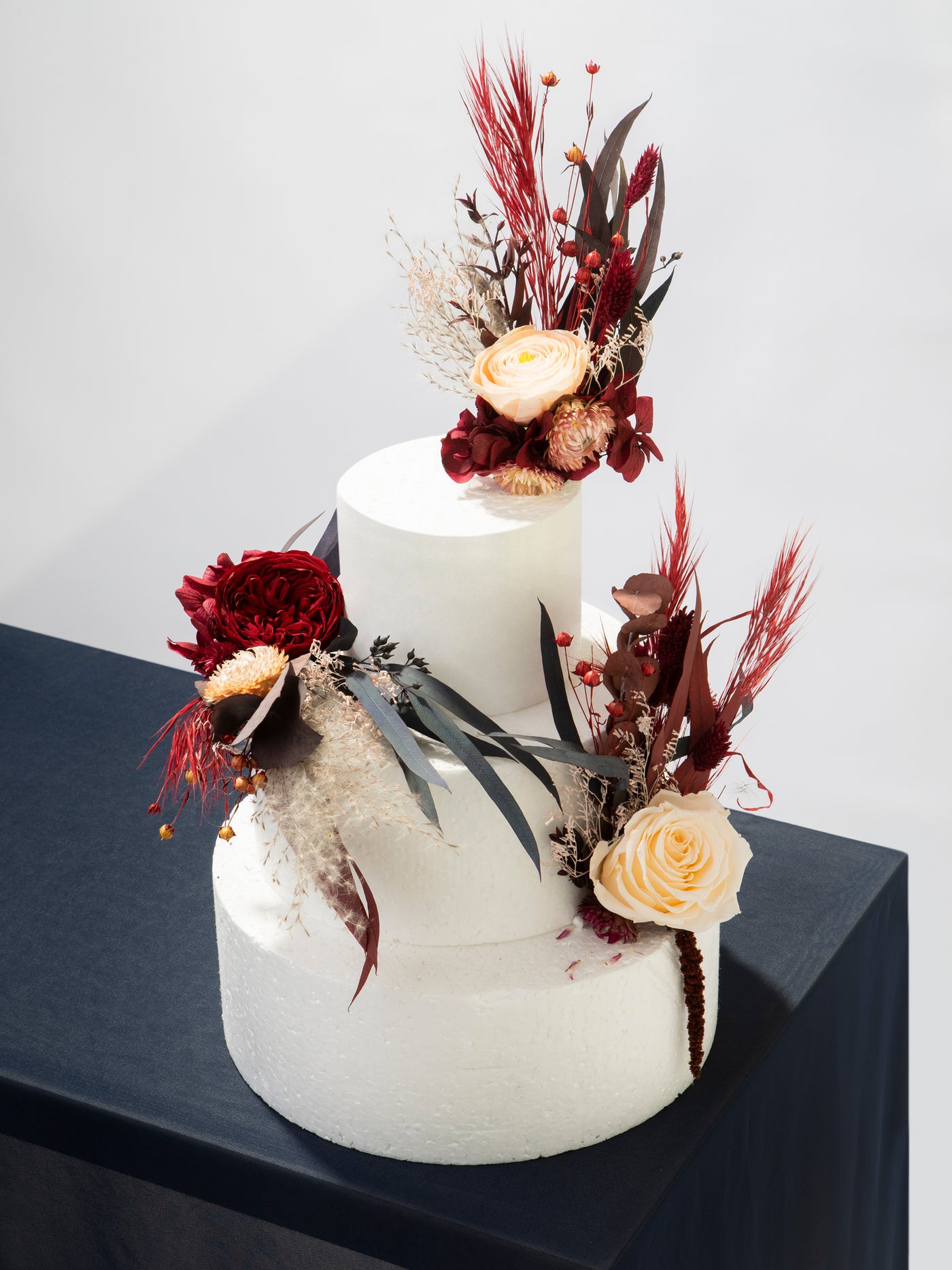 Red And Burgundy Cake Toppers With Dusty Flowers