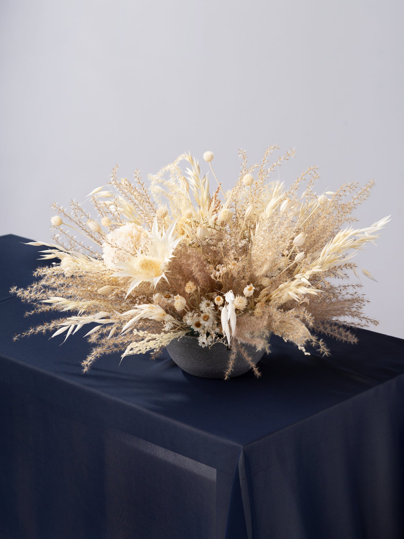 Centerpiece With Cream Dried Limoium, Eryngium Flower And Ammobium