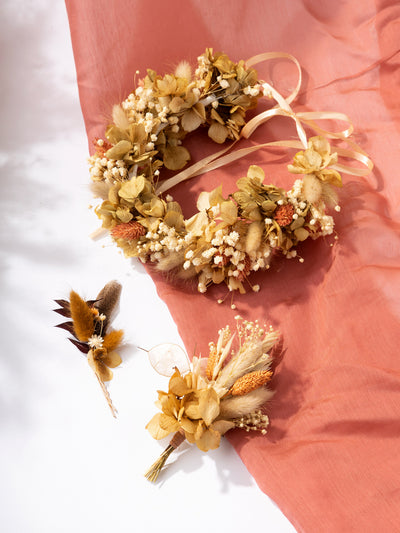 Boutonniere with terracotta rose flower for groom in boho style