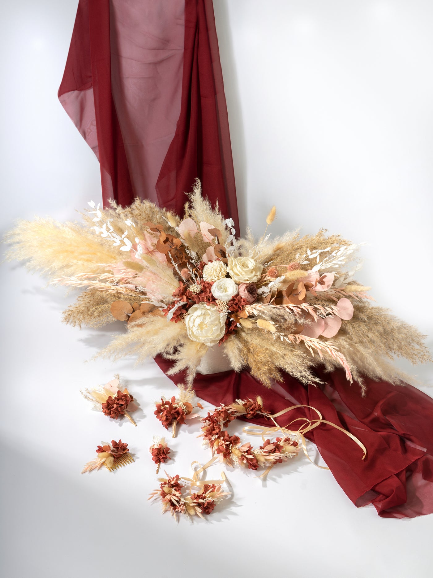 Wedding Table Top With Dusty Rose Flowers, Pampas Grass, And Eucalyptus