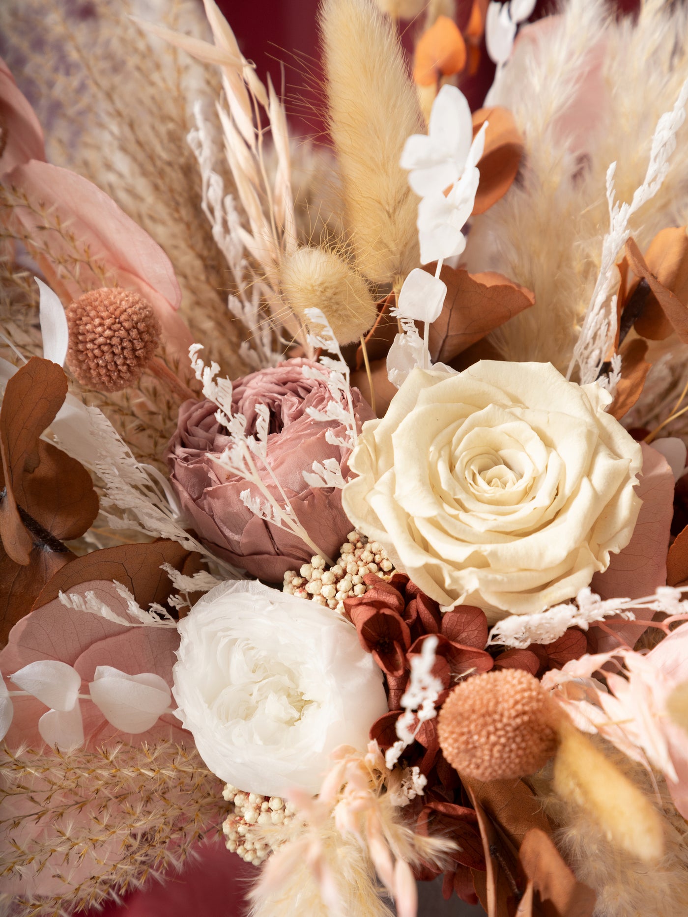 Bridal bouquet with dusty rose flowers, pampas grass, and eucalyptus