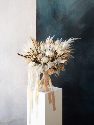 Kings protea boho white and russet colored bridal bouquet