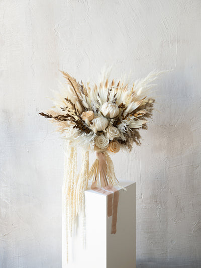 Kings protea boho white and russet colored bridal bouquet