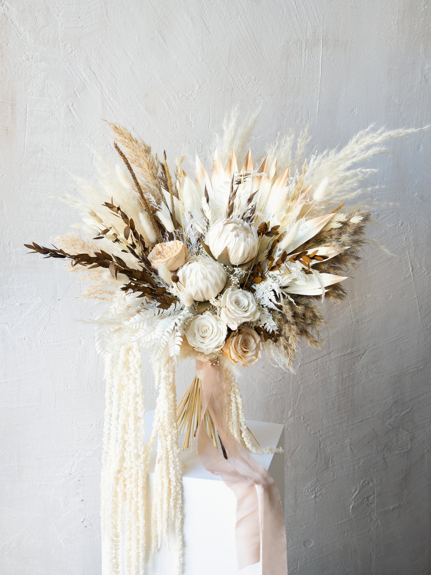 Kings protea boho white and russet colored bridal bouquet