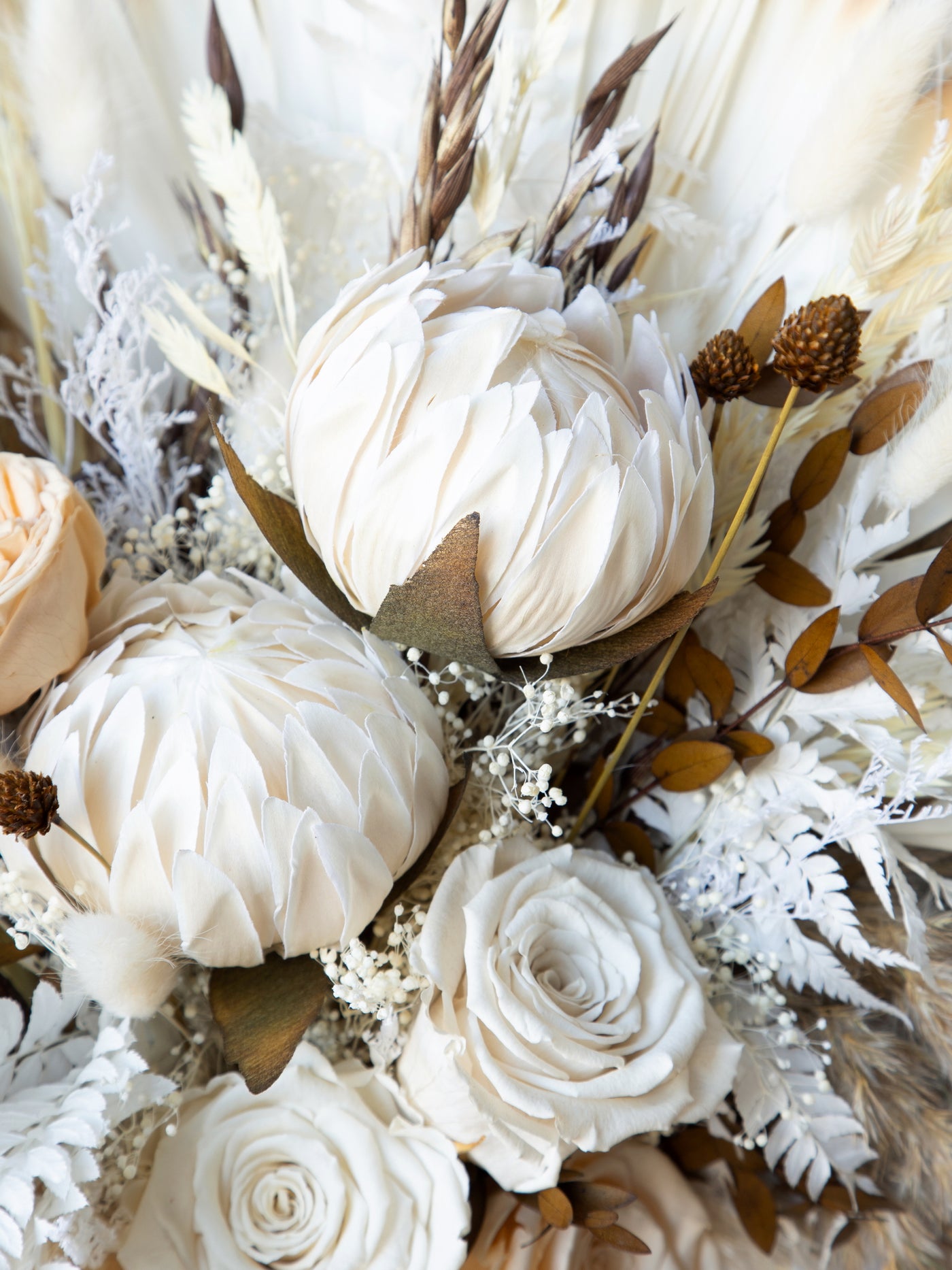 Kings protea boho white and russet colored bridal bouquet