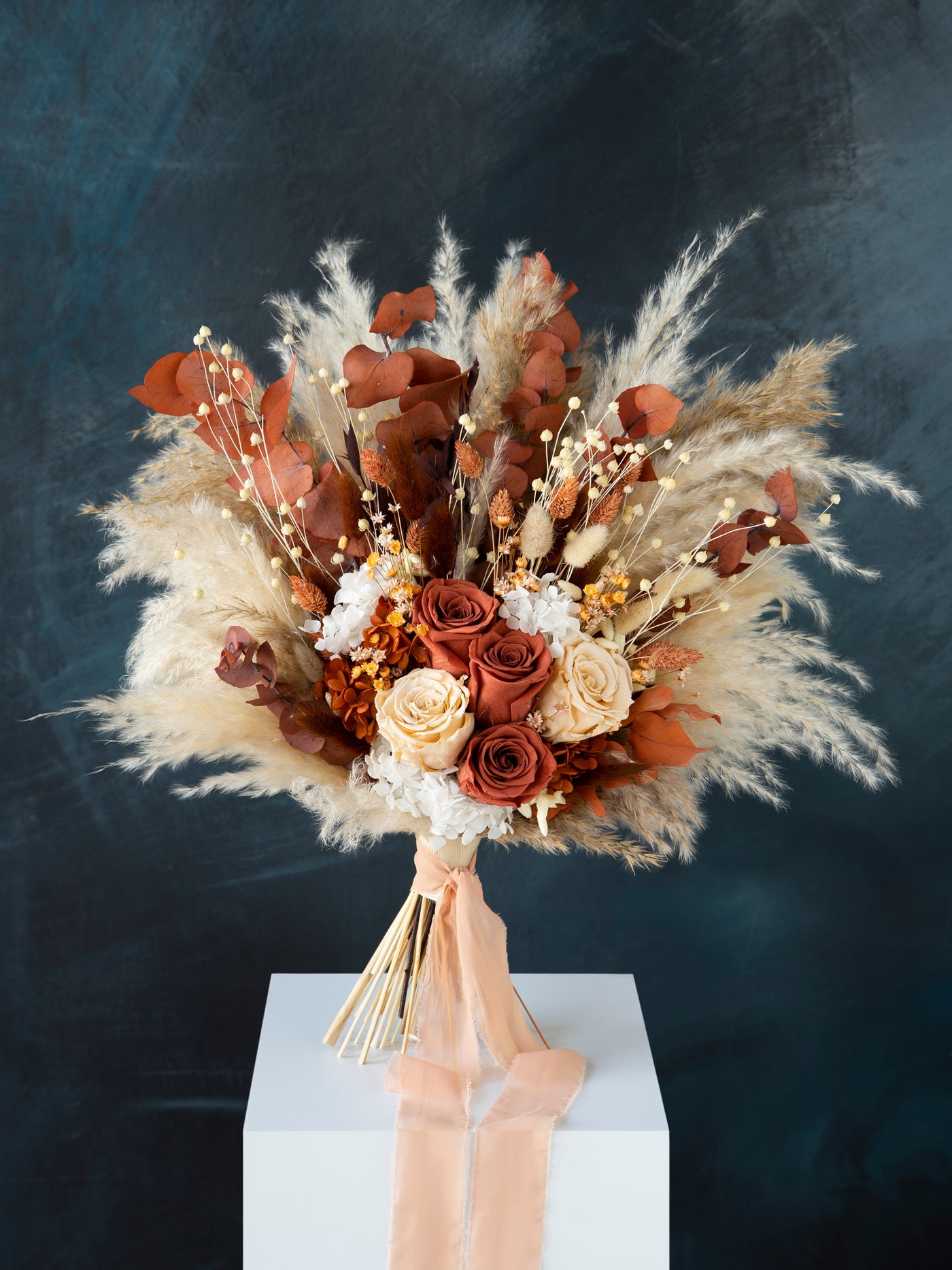 Rust and terracotta boho preserved roses wedding bouquet