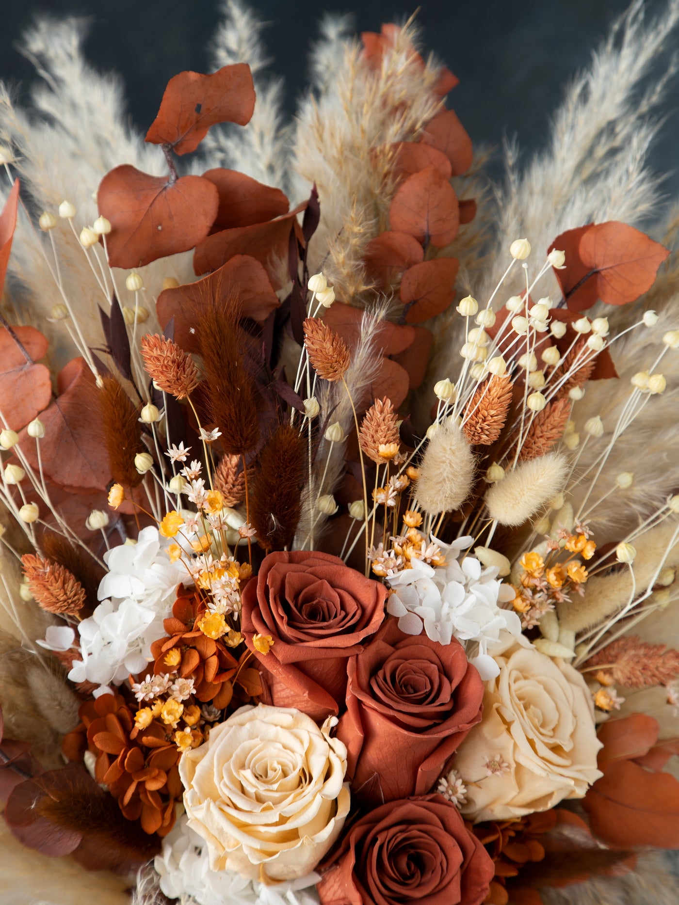 Rust and terracotta boho preserved roses wedding bouquet