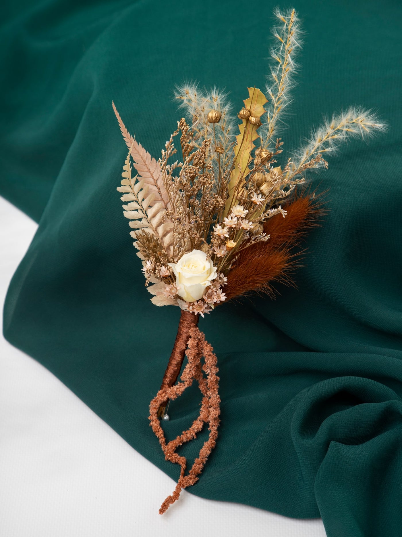 Boutonniere With Gold And Blush Flowers