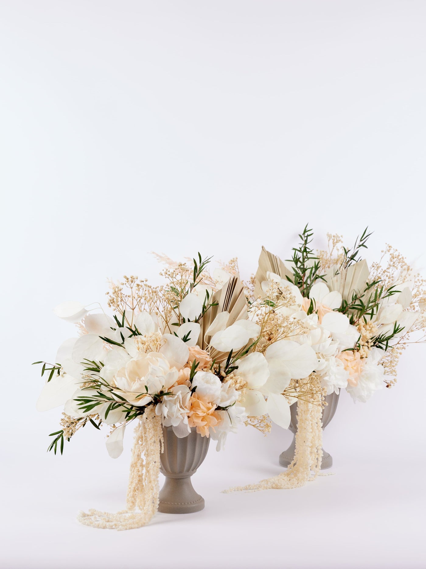 2 centerpieces are standing on white background