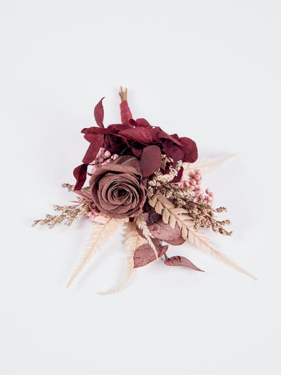 boutonnniere with flowers and rose on white background 2