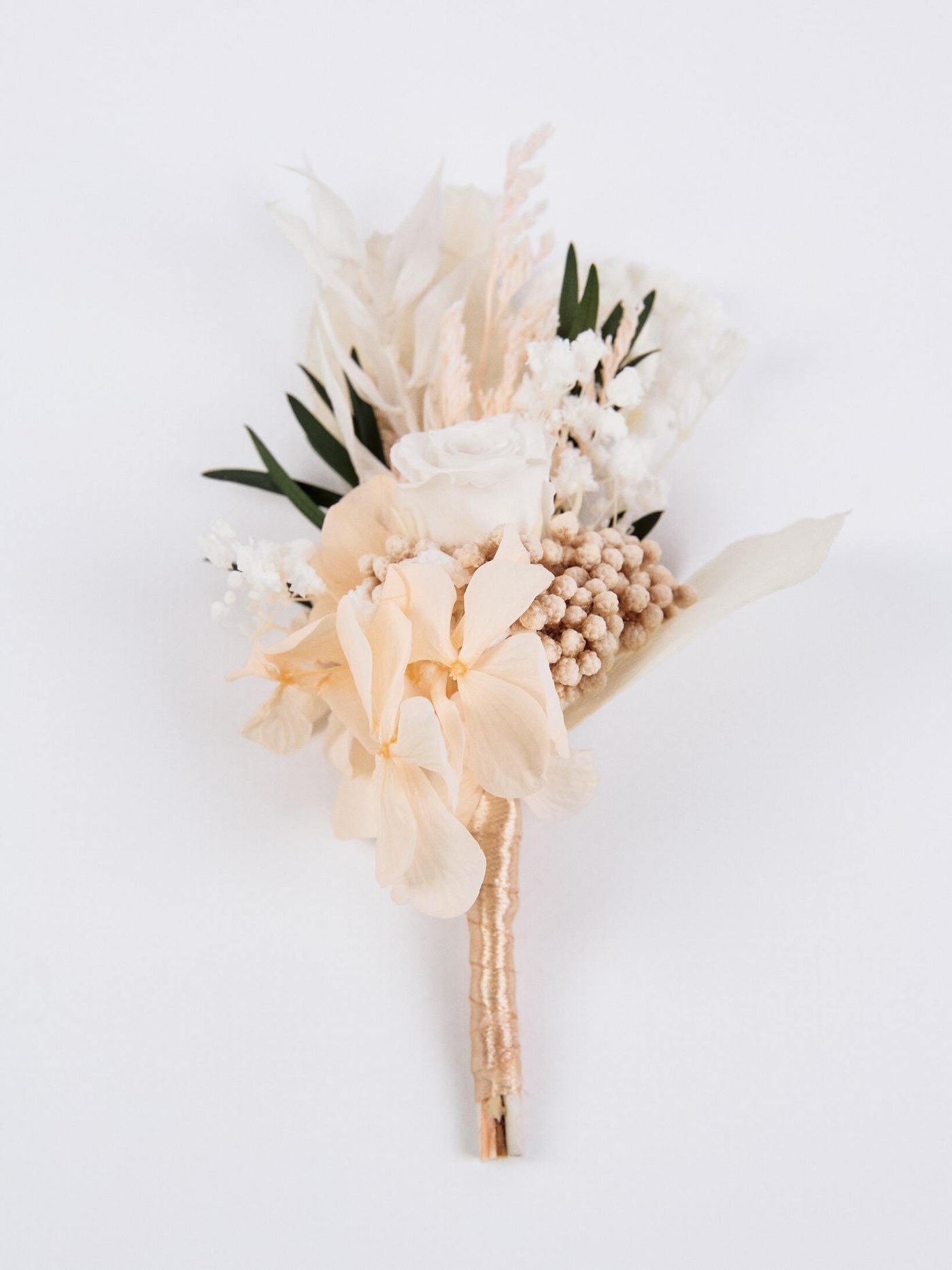 boutonniere is lying on white background