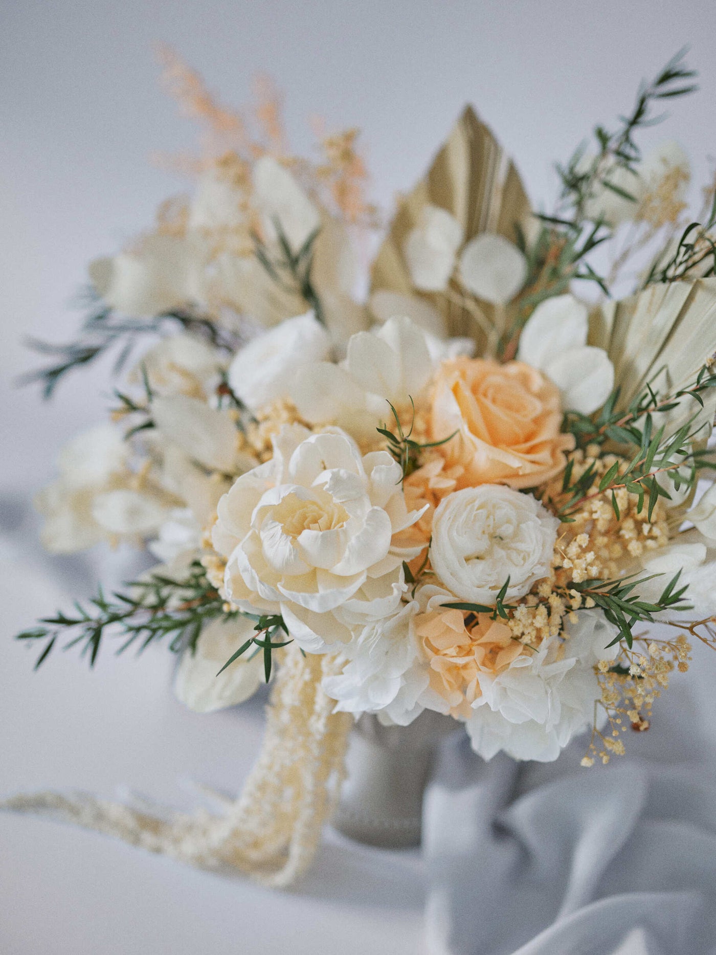 centerpiece is standing near grey fabric on white background