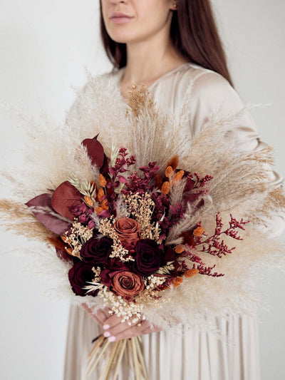 Girl with Bridal burgundy bouquet with terracotta flowers for your special day