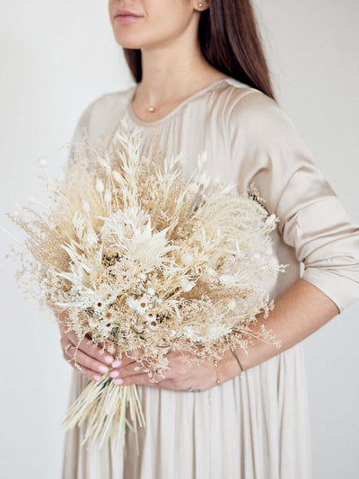 Girl with Bridal bouquet with cream dried limoium