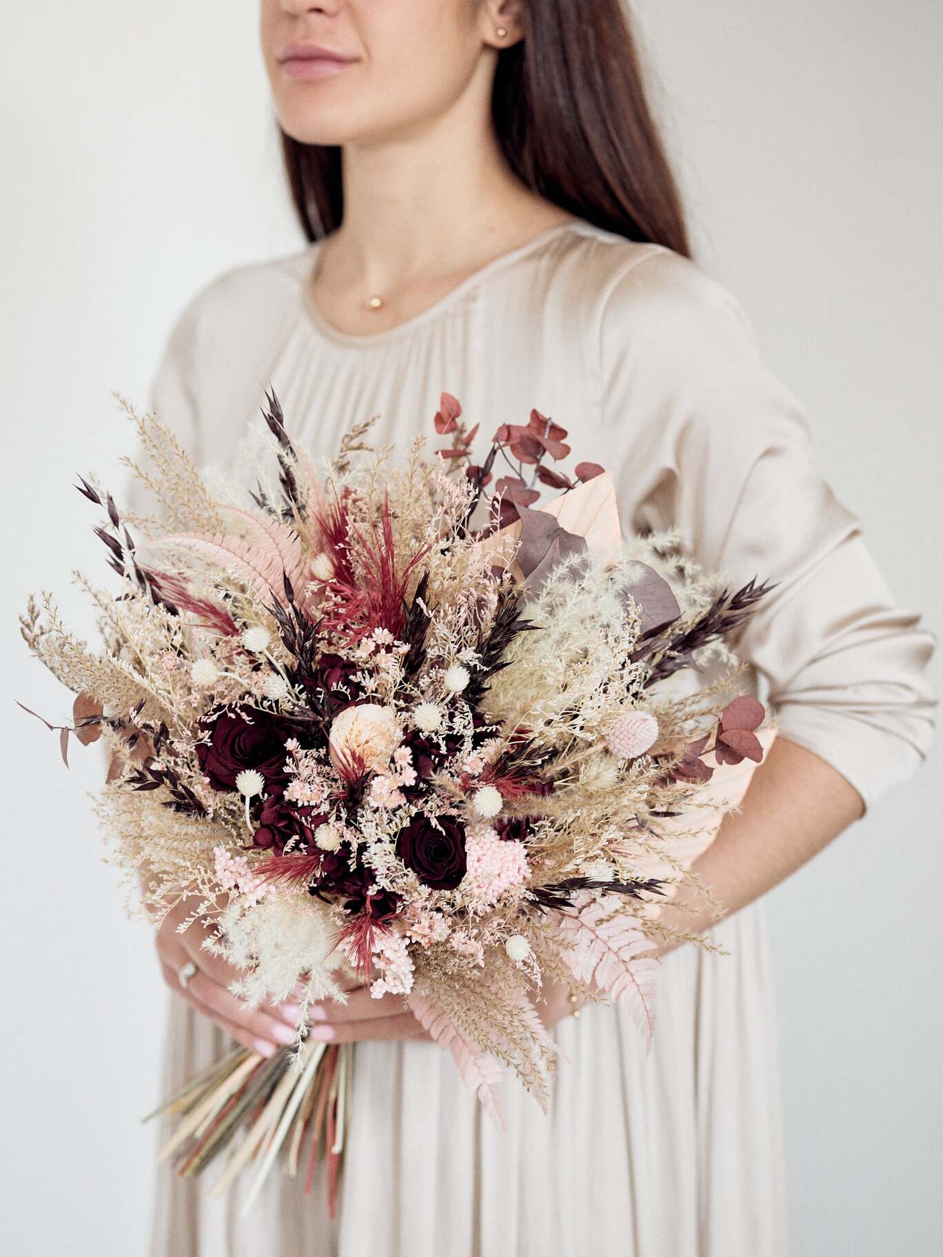 Girl with Bridal burgundy bouquet with dusty rose