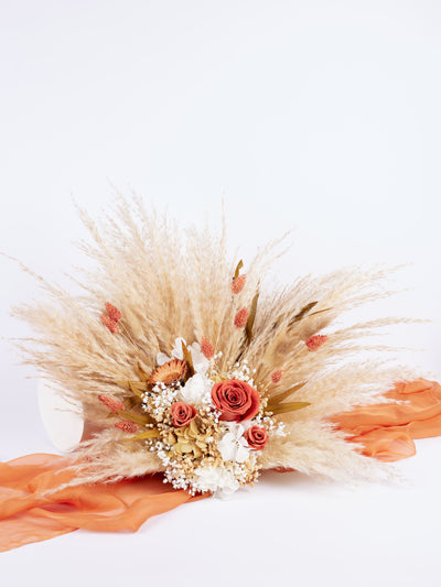 centerpiece is standing on orange organza and white background