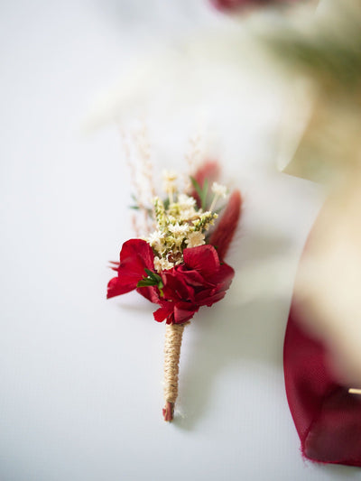 boutonniere is lying on white background