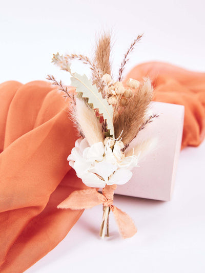 boutonniere with orange fabric behind