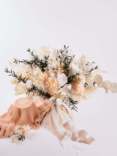 Bridal bouquet with preserved dusty roses, hydrangea and some chamomile