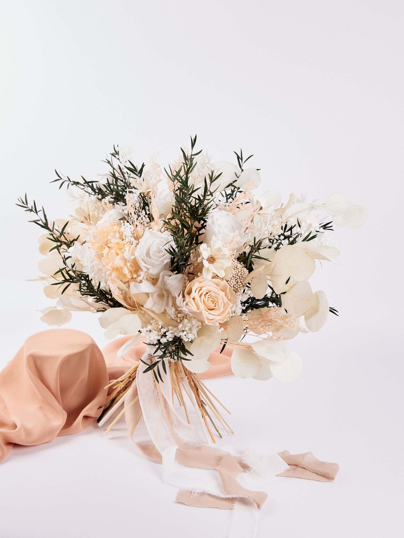 Bridal bouquet with preserved dusty roses, hydrangea and some chamomile