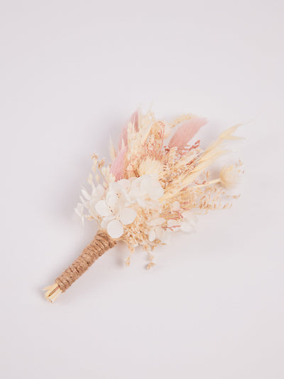 boutonniere is lying on white background