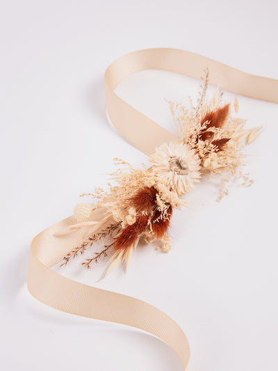 corsage is lying on white background