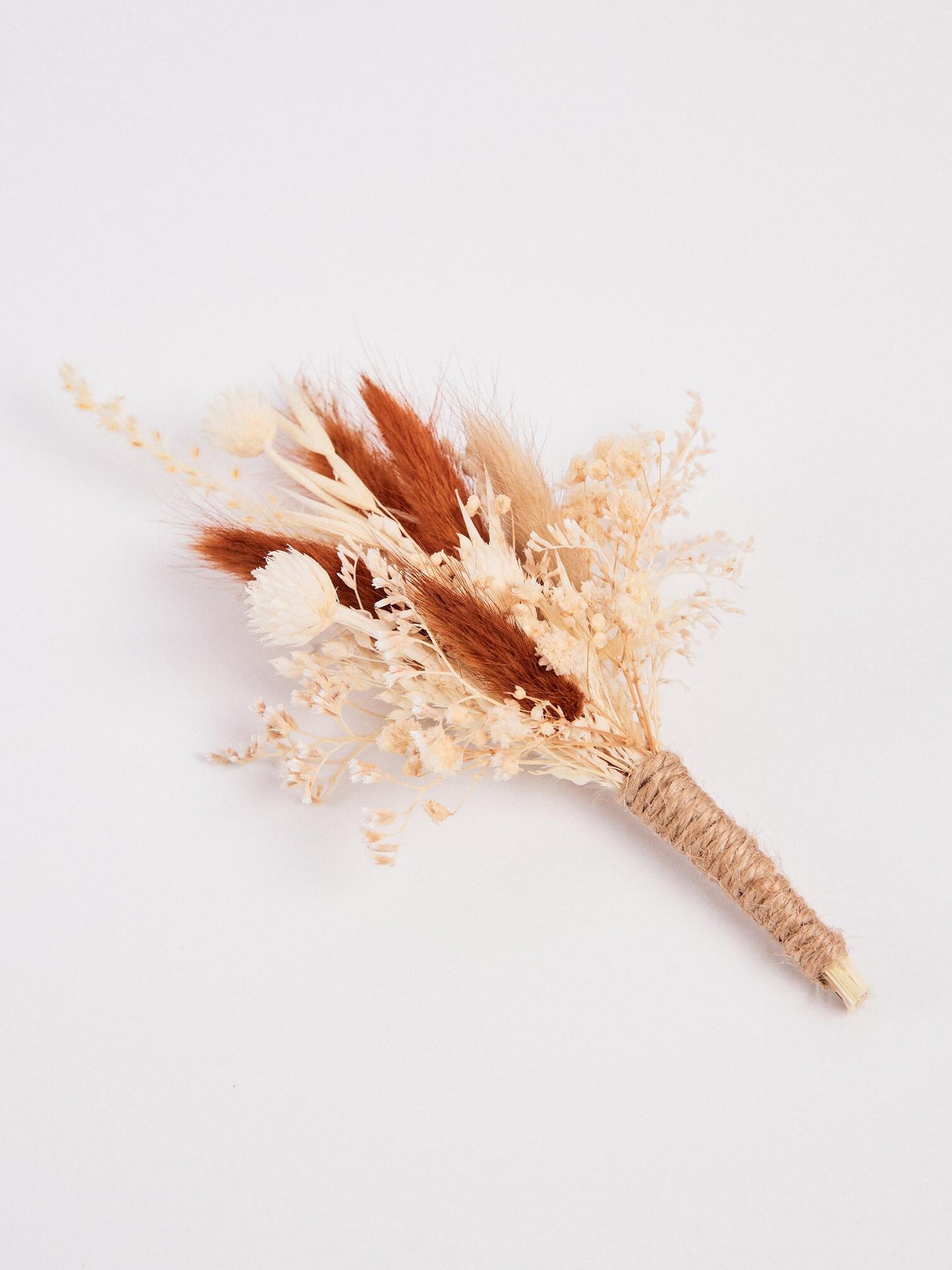 boutonniere is lying on white background