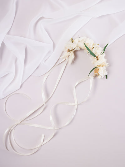 corsage is lying on white background near white organza 2