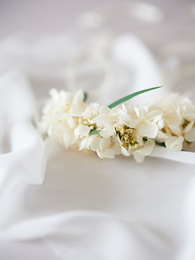 corsage is lying on white organza 3