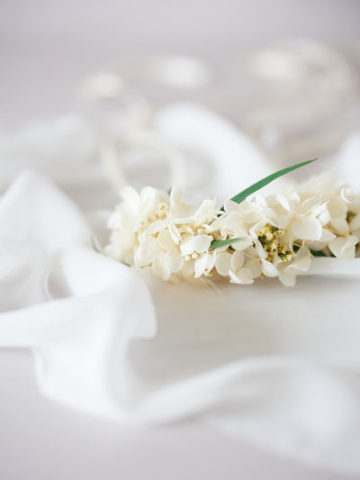 corsage is lying on white organza 4