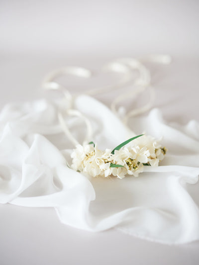 corsage is lying on white organza 5