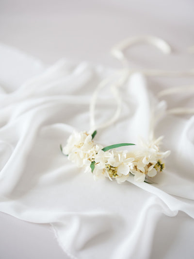 corsage is lying on white organza