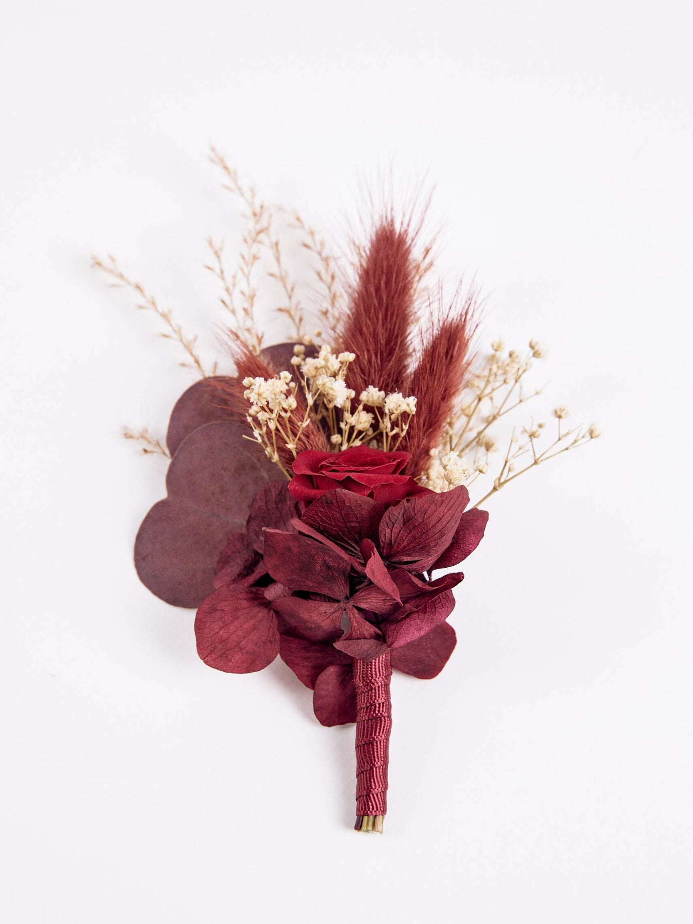 boutonniere is lying on white background