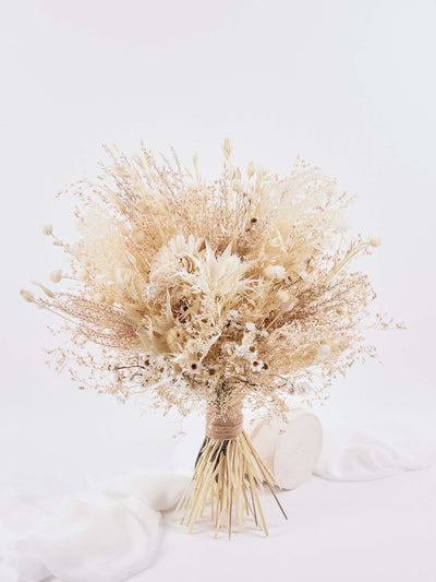 Bridal bouquet with cream dried limoium, eryngium flower, ammobium flower