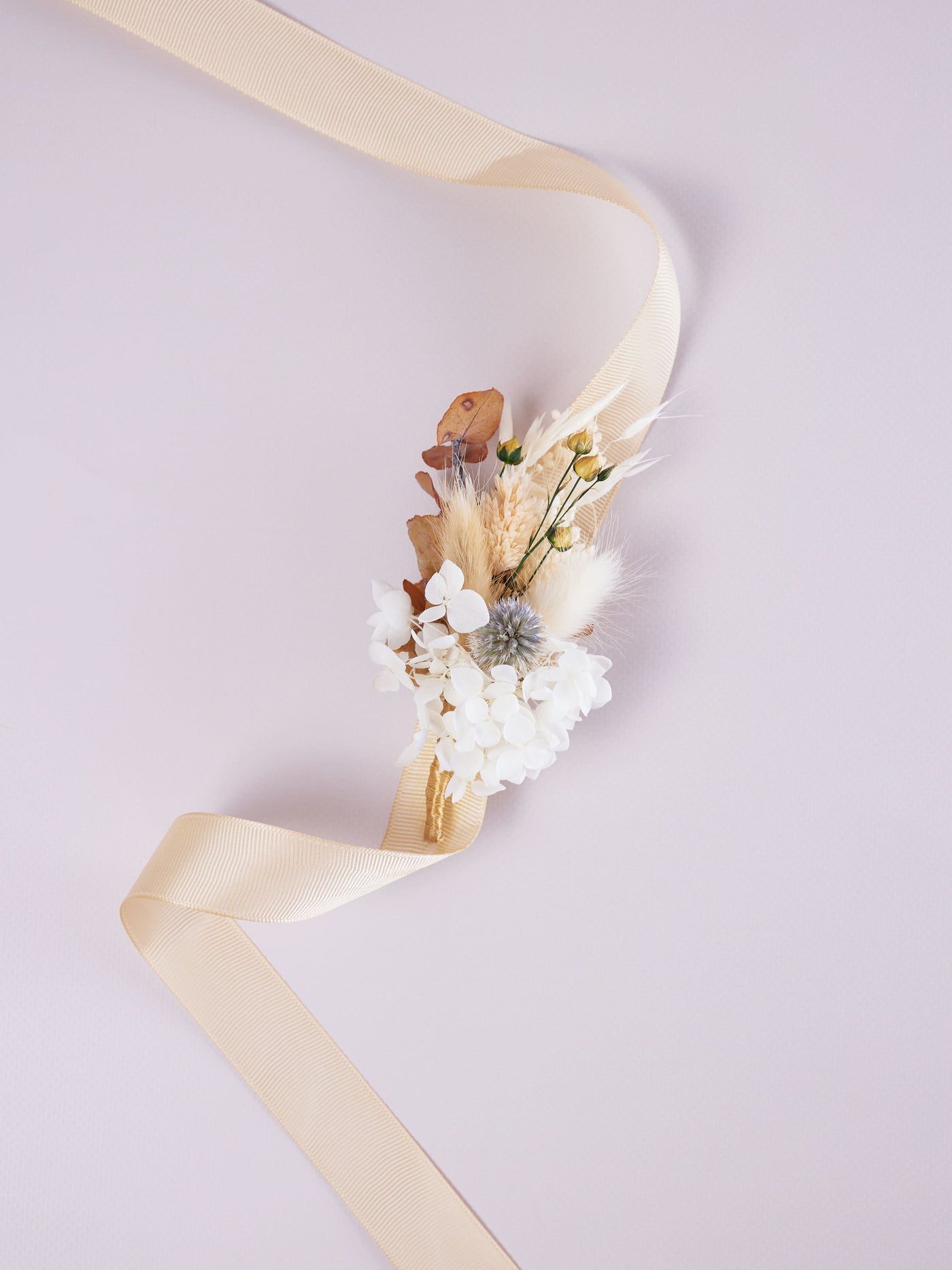 corsage is lying on white background