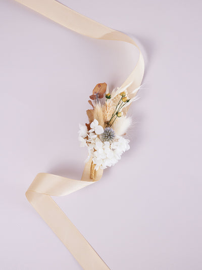 corsage is lying on white background