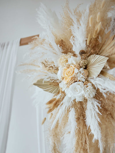 arch flowers with roses and pampas grass, close up view