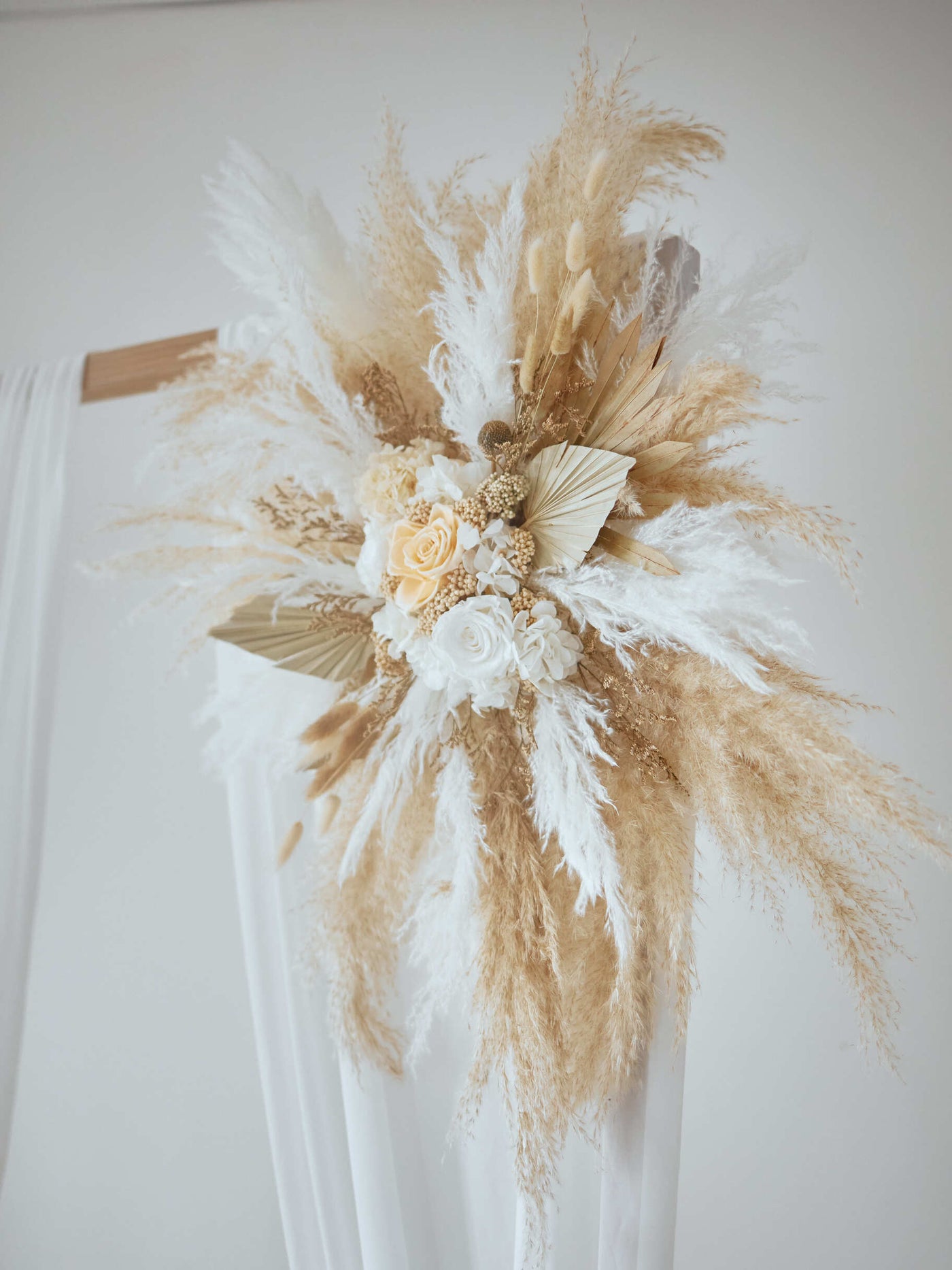 arch flowers with roses and pampas grass, close up view 2