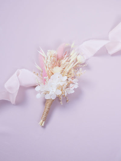 boutonniere on light pink background