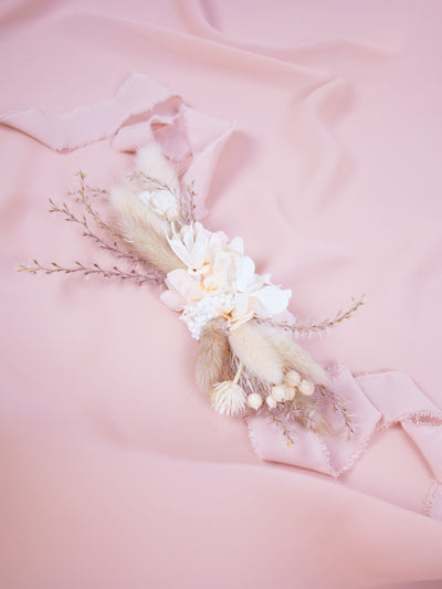 corsage is lying on pink organza 2